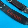Canon® Canon Black & Red SLR Camera Strap -Film Camera Store canon black and red slr camera strap 1