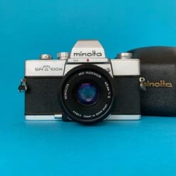 Minolta SRT100X 35mm SLR Film Camera W/ Prime Lens & Original Leather Case